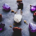 Beautiful amethyst crystals with a bright clear crystal in the middle of the picture